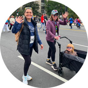 Participants at the 2025 Race for Every Child event walk and wave.